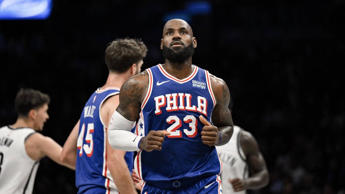 LeBron James of the Philadelphia 76ers reacts to a call by the offiical on an NBA court.